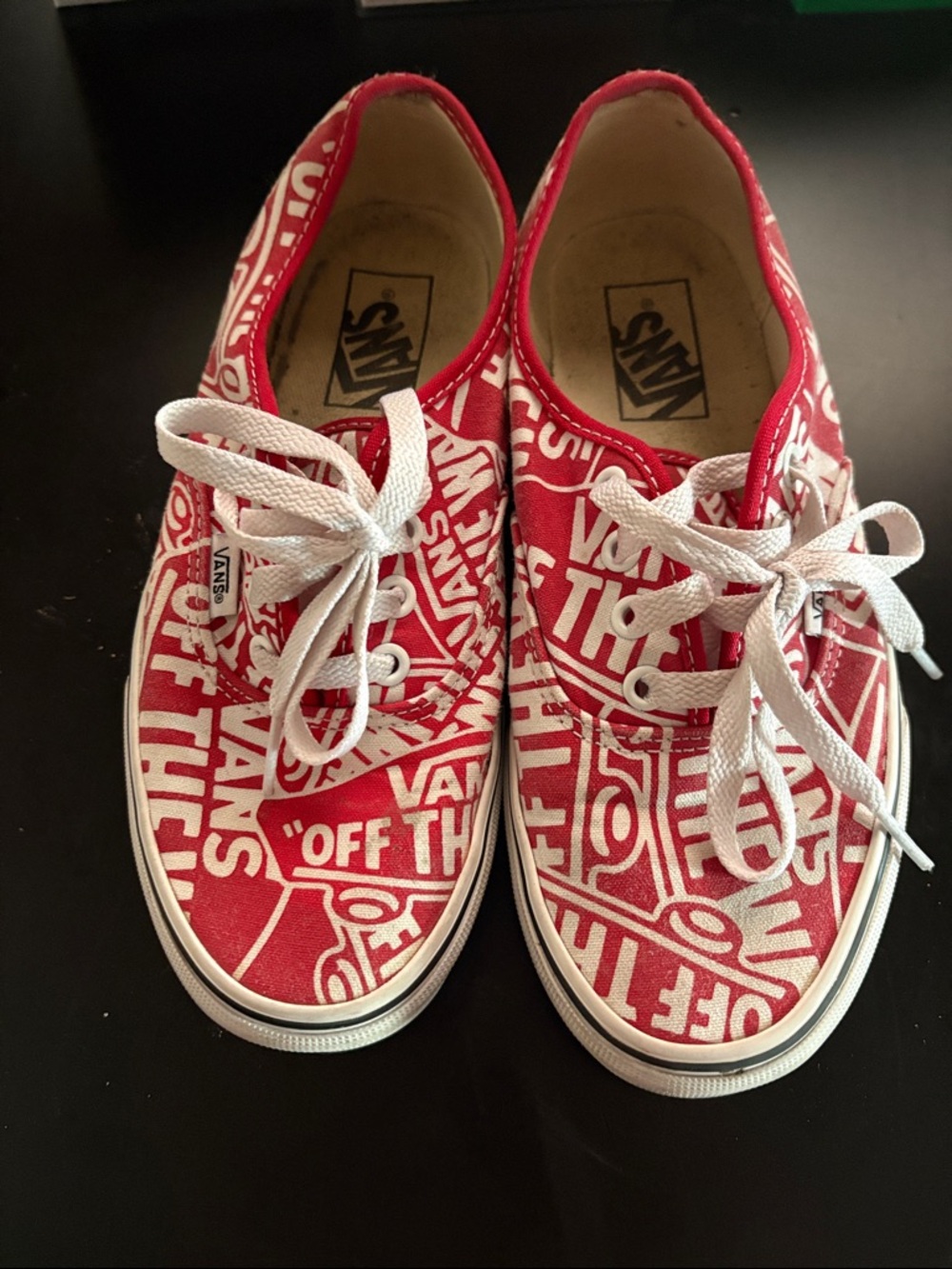 Red Vans logo shoes